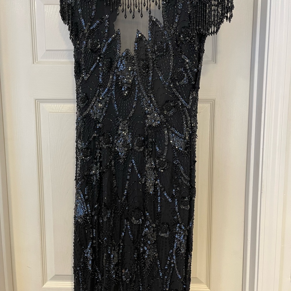 Beaded dress. Eyelet closure needs to be sewen , open back